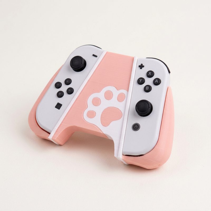 PAWPRINT DUAL CONTROLLER GRIP